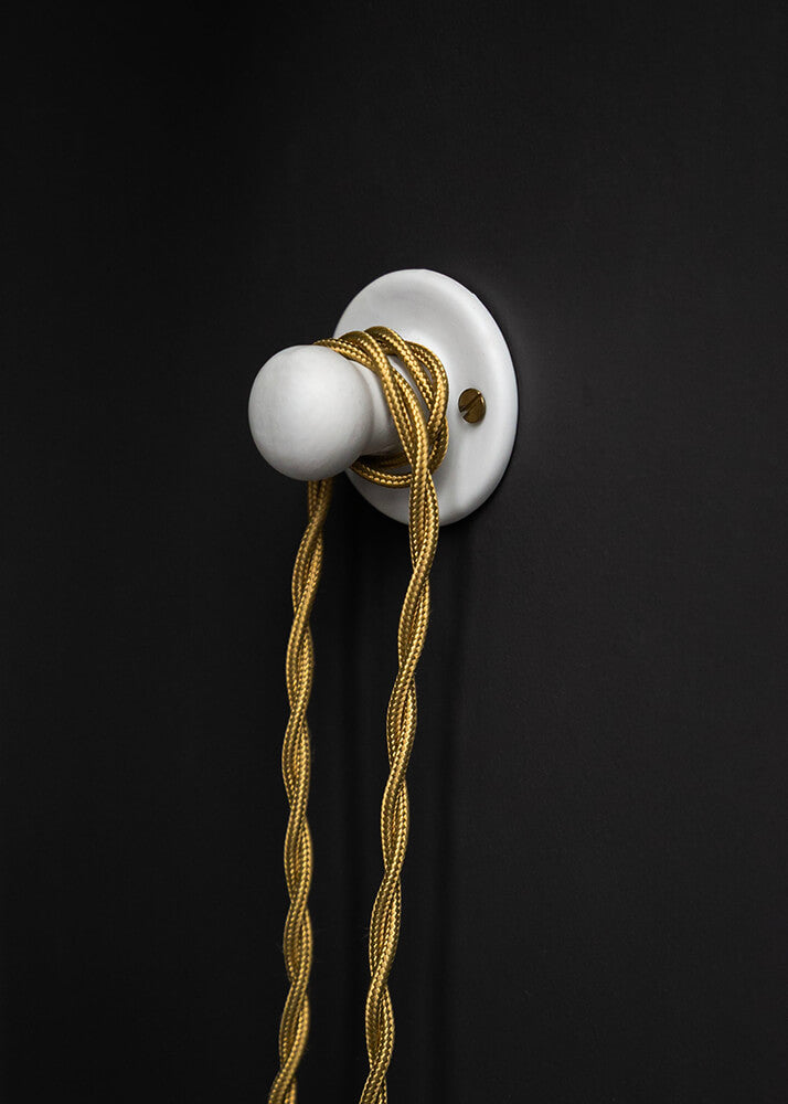 Small white porcelain wall peg