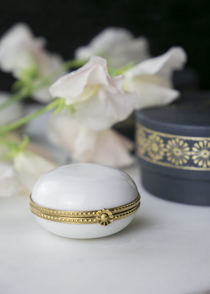 White porcelain pillbox set in brass