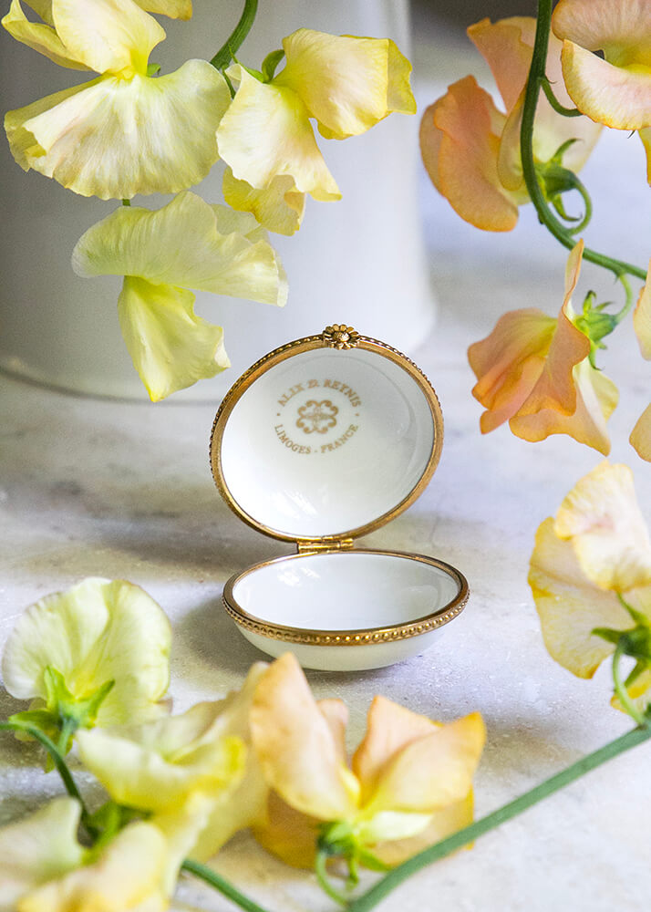 White porcelain pillbox set in brass
