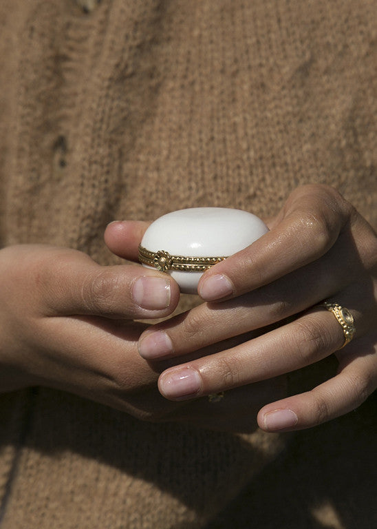 White porcelain pillbox set in brass