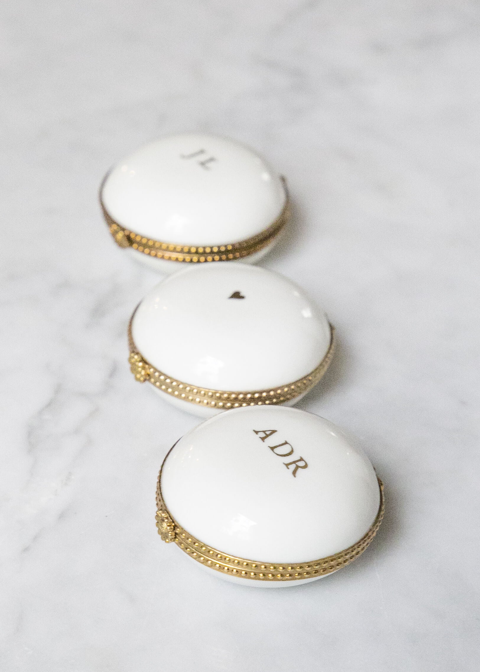 White porcelain pillbox set in brass