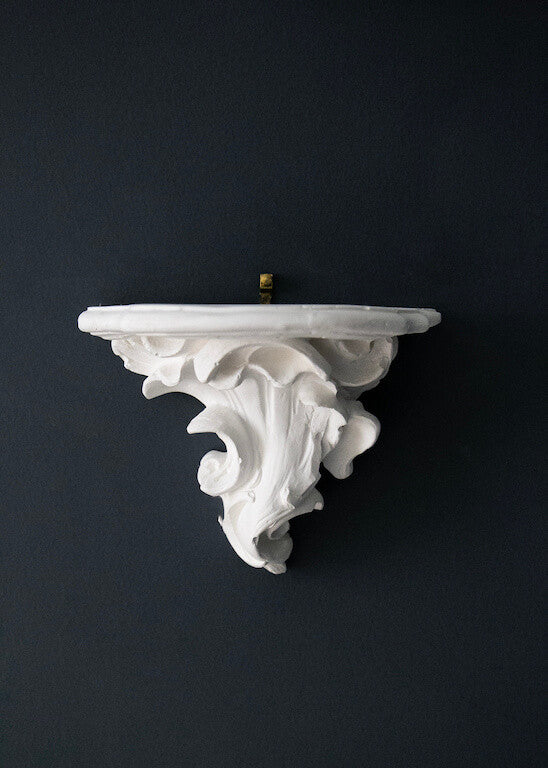 Scrolled plaster console