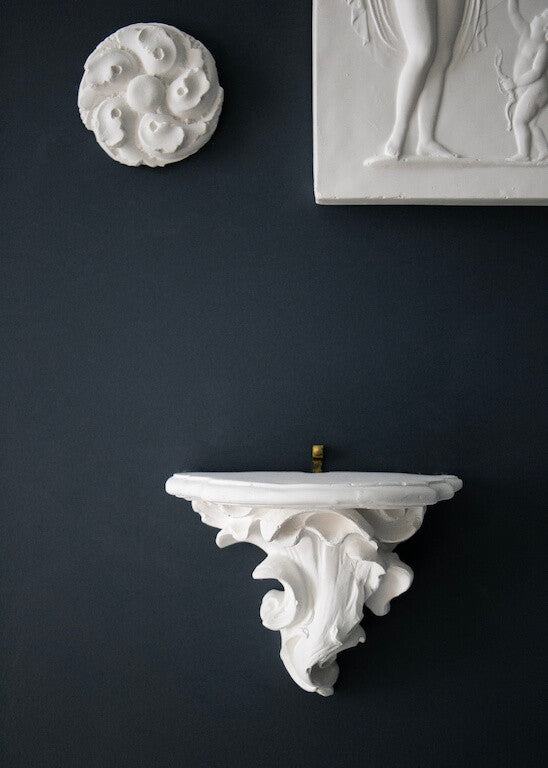 Scrolled plaster console