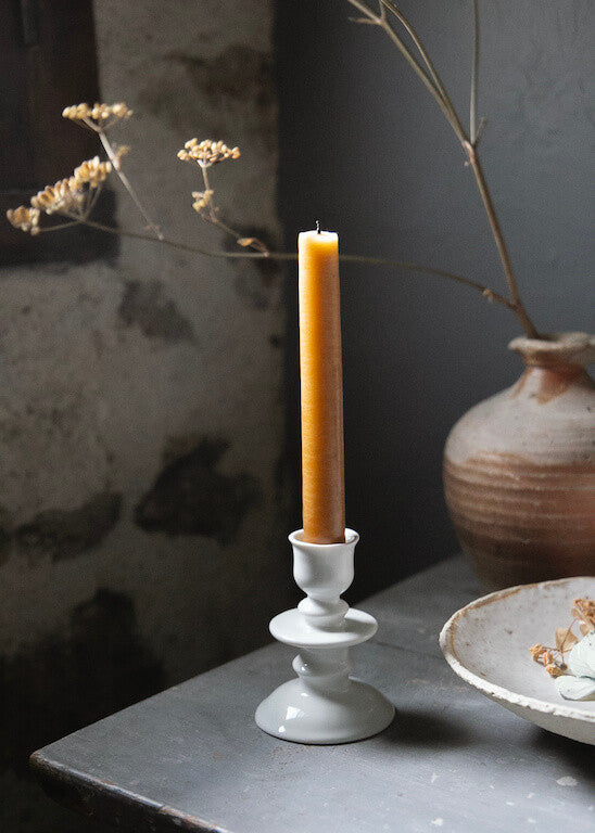 Disk candle holder in white porcelain