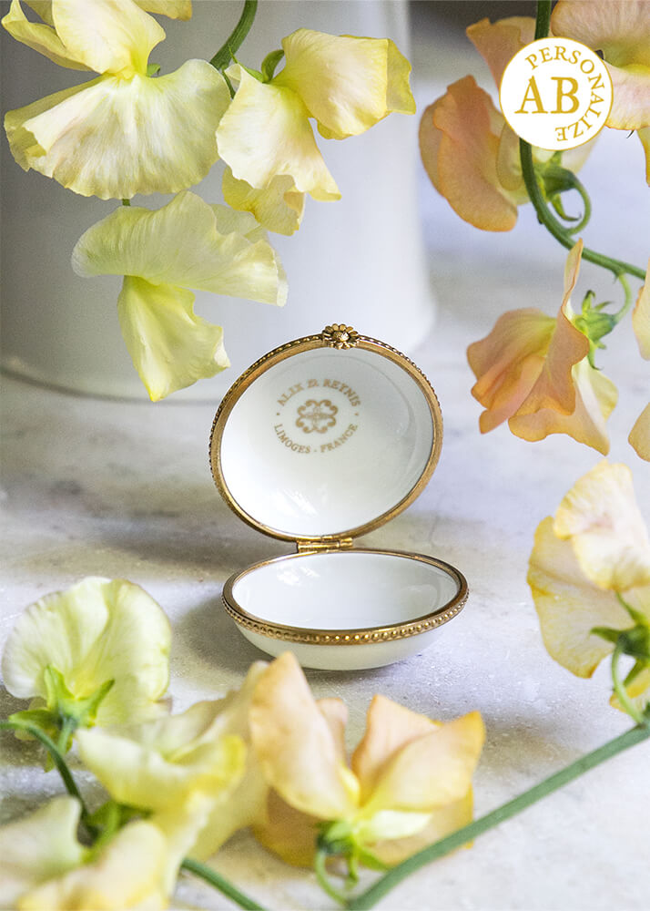 White porcelain pillbox set in brass