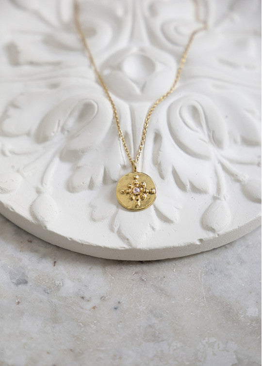 Orion 18 carat gold and diamond medal